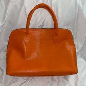 Orange leather handbag